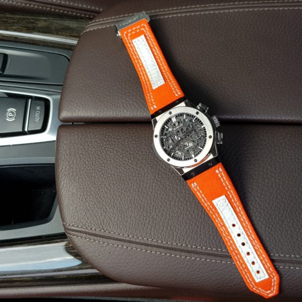 Clementine Canvas by gunny straps an orange canvas with white leather accent on this very sporty strap shown on hublot classic fusion wristwatch