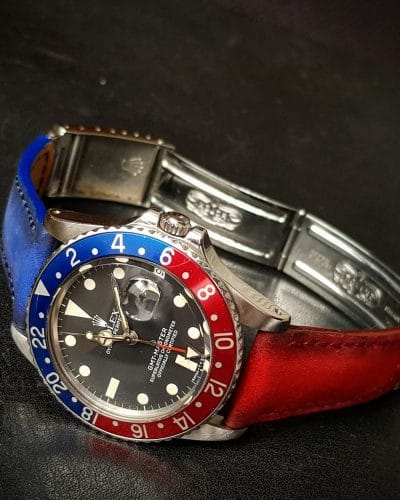 Suede bi color red and blue strap by Gunny Straps official online store shown on rolex pepsi gmt master