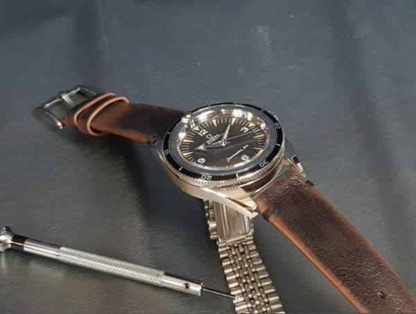 leather strap with minimalist and style and mysterious vintage brown color that created by gunny straps official online store called gurney 4 series shown on omega seamaster speedmaster railmaster rolex