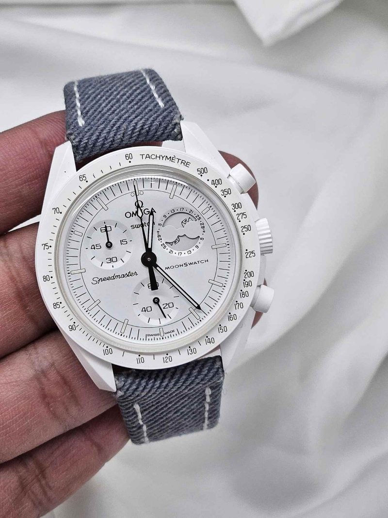 denim opaline blue strap on moonswatch snoopy by tommy