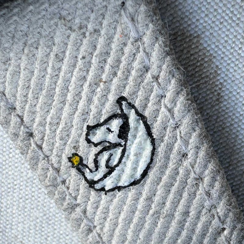 White Black Two Tone Denim Strap with Snoopy on Omega Moonswatch by Gunny Straps - Close Up